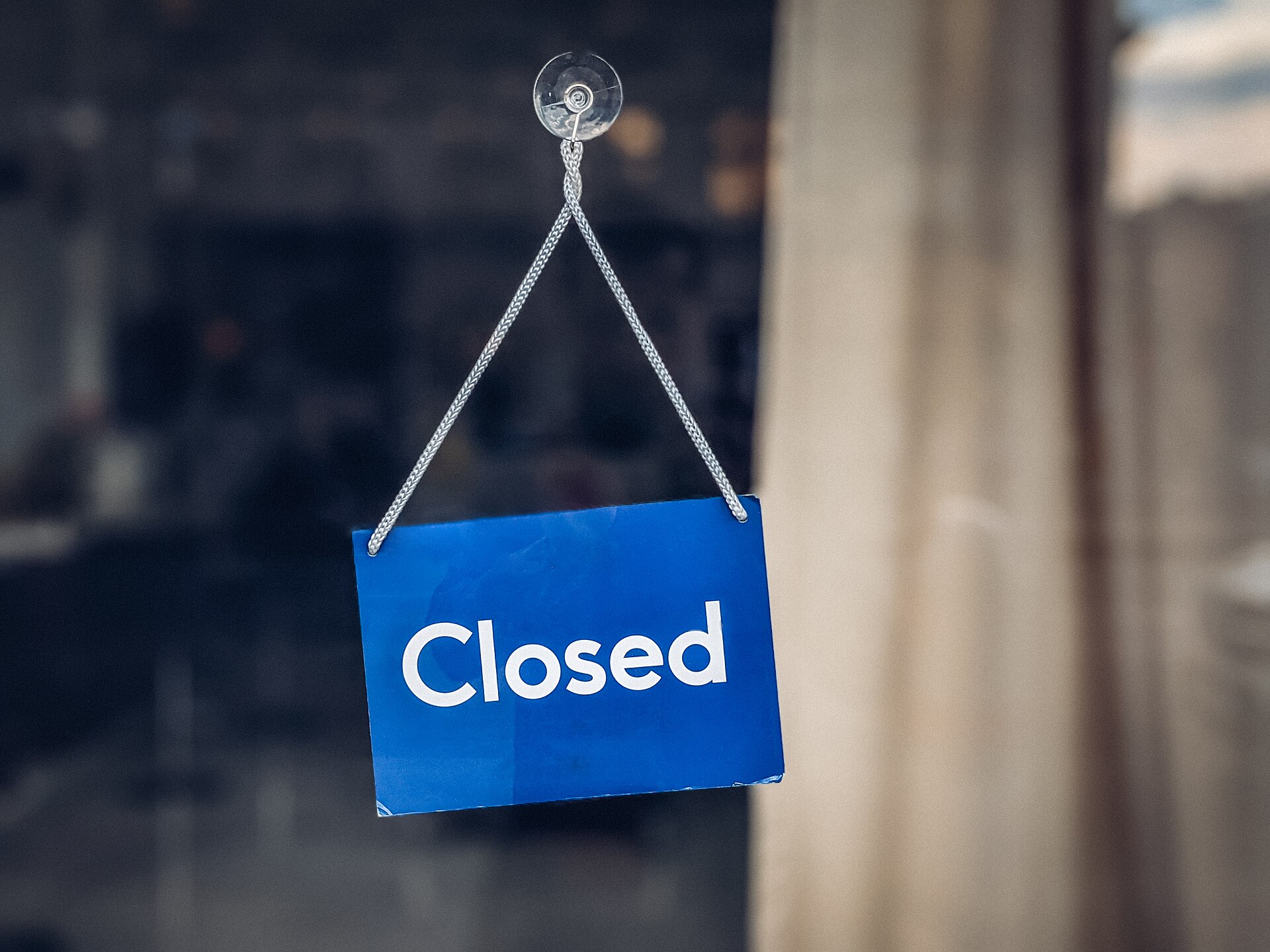 closed shop door sign